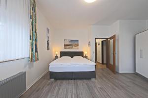 Postel nebo postele na pokoji v ubytování Hotel Hülsmann Garni