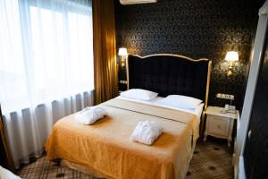 Postel nebo postele na pokoji v ubytování Olympic Hotel + 37 fotografií