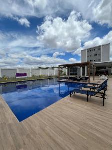 a swimming pool on the roof of a building at Condomínio Indianopolis a 1,4km do North Shopping in Caruaru