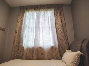 G9 Hotel Alor Setar客房内的一张或多张床位
