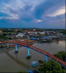 a train on a bridge over a river at Village Retreat Jetty Kuala Perlis in Kuala Perlis +15 photos