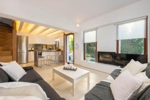 a living room with a couch and a table at Katerina Boutique Villa in Rhodes Town