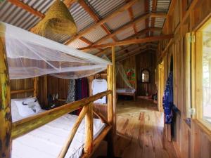 Postel nebo postele na pokoji v ubytování Papaya Lodge