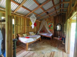 Postel nebo postele na pokoji v ubytování Papaya Lodge