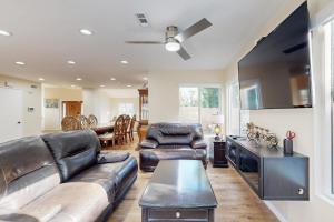 a living room with a couch and a table at Rancho Retreat in Rancho Cucamonga