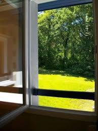 a window with a view of a green field through it at IBIS BUDGET Biarritz - Anglet in Anglet +10 photos