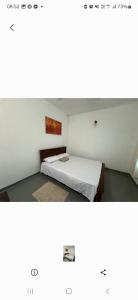 a small bedroom with a bed in a room at Two room flat in colombo 5 in Narahenpita