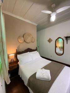 Postel nebo postele na pokoji v ubytování Casa Coco Verde Paraty