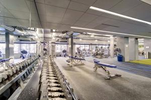 a gym with rows of chairs and exercise equipment at Cozy 2 BR Apartment At Arlington With Gym in Arlington