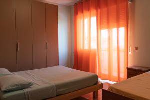 Ένα ή περισσότερα κρεβάτια σε δωμάτιο στο Casa vacanze La Terrazza