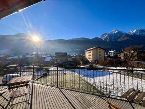 a balcony with a view of a snowy mountain at La Terrasse de Dyno in Nus