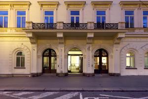 a building with a balcony on top of it at Eurostars Thalia in Prague