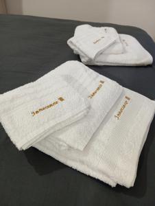 two white towels sitting on top of a bed at Casa vacanza Città dei Papi Anagni in Anagni +91 photos