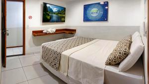 a bedroom with a bed in a room at Rede Andrade Mini in Jericoacoara