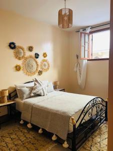 Ένα ή περισσότερα κρεβάτια σε δωμάτιο στο Appartement a 4 Minutes de la plage