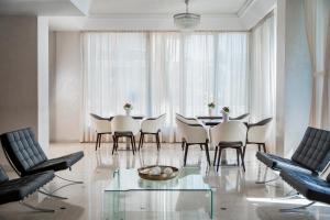 a dining room with a table and chairs at Hotel Du Soleil in Rimini