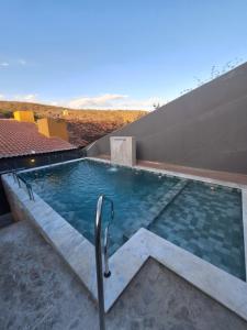a swimming pool on top of a building at Pousada Lua Rosa in Piranhas +38 photos