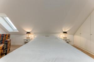 Postel nebo postele na pokoji v ubytování Goldstück 16 - Viktoria Residenz + 29 fotografií