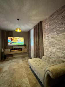 TV a/nebo společenská místnost v ubytování Le boudoir suite&spa
