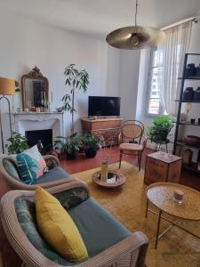 TV a/nebo společenská místnost v ubytování Appartement CLADA/ Côté Lac