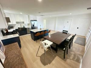 a kitchen and dining room with a table and chairs at Waterfront property in Bethel Island in Bethel Island +8 photos