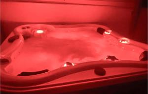 a red bath tub with lights in a red room at Stunning Home In Split in Split