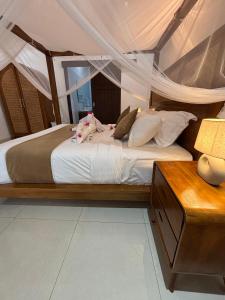 Postel nebo postele na pokoji v ubytování De Luxe Villa Fabian Escape in Seminyak