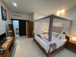 Postel nebo postele na pokoji v ubytování De Luxe Villa Fabian Escape in Seminyak