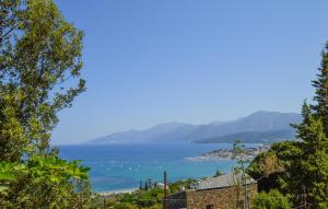 a view of a body of water with mountains at Nice Apartment In Santu Pietru Di Tenda in Santo-Pietro-di-Tenda +22 photos