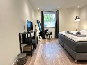 Ένα ή περισσότερα κρεβάτια σε δωμάτιο στο M&K Homes Eleganter Neubau zwischen Hamburg&Ostsee mit Parkplatz