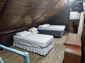 Postel nebo postele na pokoji v ubytování Cabana rústica a 900m da Praia da Ribanceira