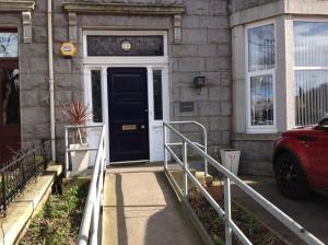 a front door of a house with a black door at Hannahs Guesthouse in Aberdeen