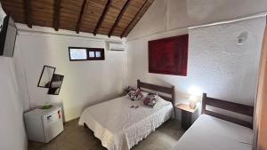 Postel nebo postele na pokoji v ubytování Hospedagem Estalagem Paraty para temporada