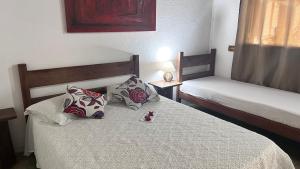 Postel nebo postele na pokoji v ubytování Hospedagem Estalagem Paraty para temporada