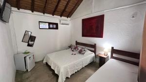 Postel nebo postele na pokoji v ubytování Hospedagem Estalagem Paraty para temporada