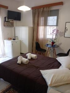 Postel nebo postele na pokoji v ubytování VALIA ROOMS