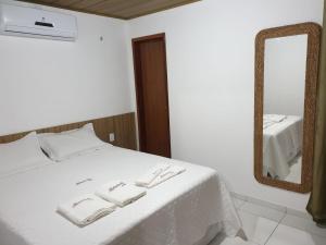 Postel nebo postele na pokoji v ubytování Chaleville Coqueiro 3602