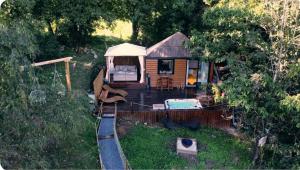 an aerial view of a backyard with a house at le ptit couki in Chimay +9 photos