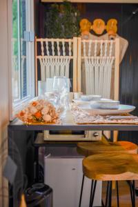a counter with a table with some food on it at le ptit couki in Chimay