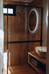 a bathroom with a sink and a mirror at Valley Hills-котедж на схилах гір з чаном-джакузі in Slavske +46 photos