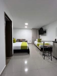 Voodi või voodid majutusasutuse Hotel Granada Suites - AV 9 toas