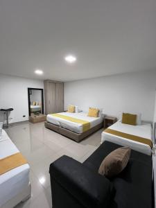 Voodi või voodid majutusasutuse Hotel Granada Suites - AV 9 toas