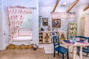 a kitchen with a table and chairs and a window at Adobe Grand Villas in Sedona