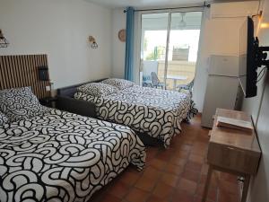 Studio California à Tartane客房内的一张或多张床位