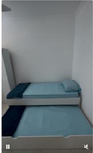 Postel nebo postele na pokoji v ubytování Residencial Portinari