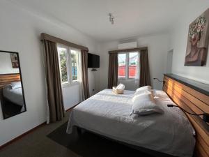 Postel nebo postele na pokoji v ubytování Casona Italia B & B