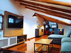 TV a/nebo společenská místnost v ubytování Illa B&B