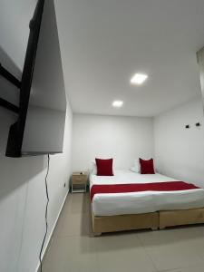 Voodi või voodid majutusasutuse Hotel Granada Suites - AV 9 toas