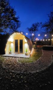 a small dome house at night with lights at Duke End Retreat in Coleshill