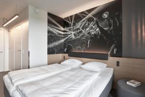 Four Points Flex by Sheraton Copenhagen Arena房間的床